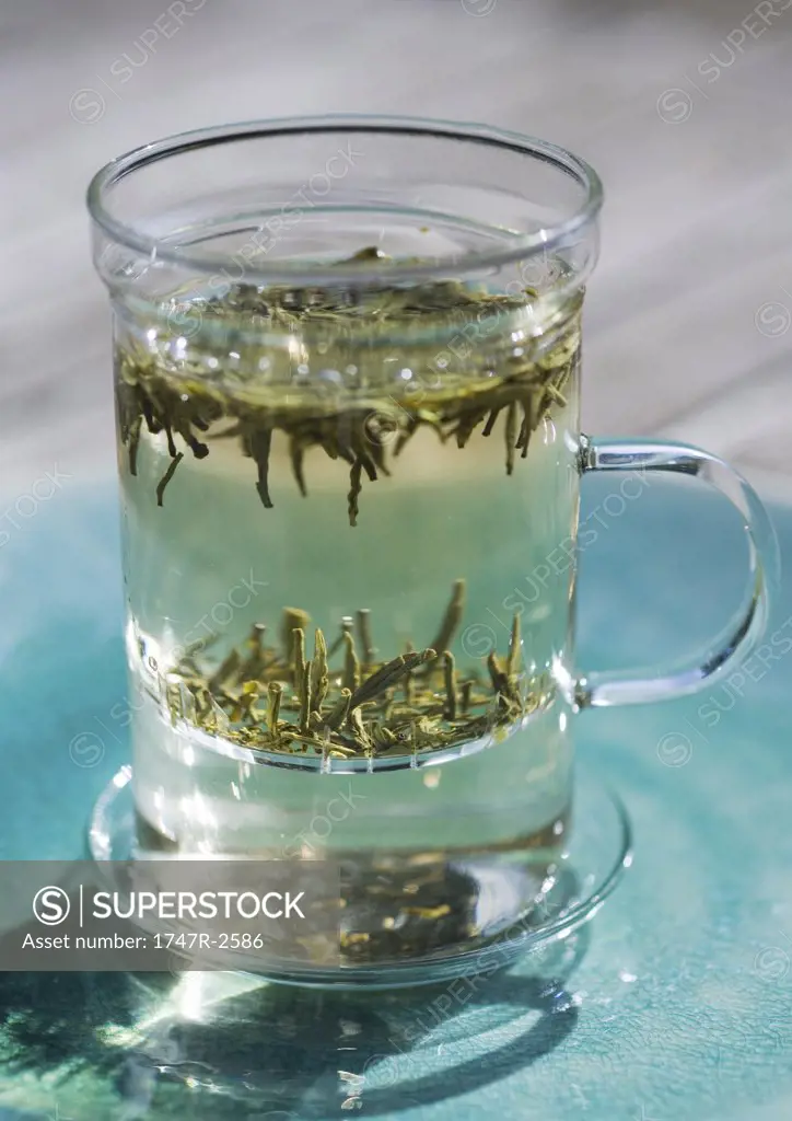 Cup of tea with loose tea leaves