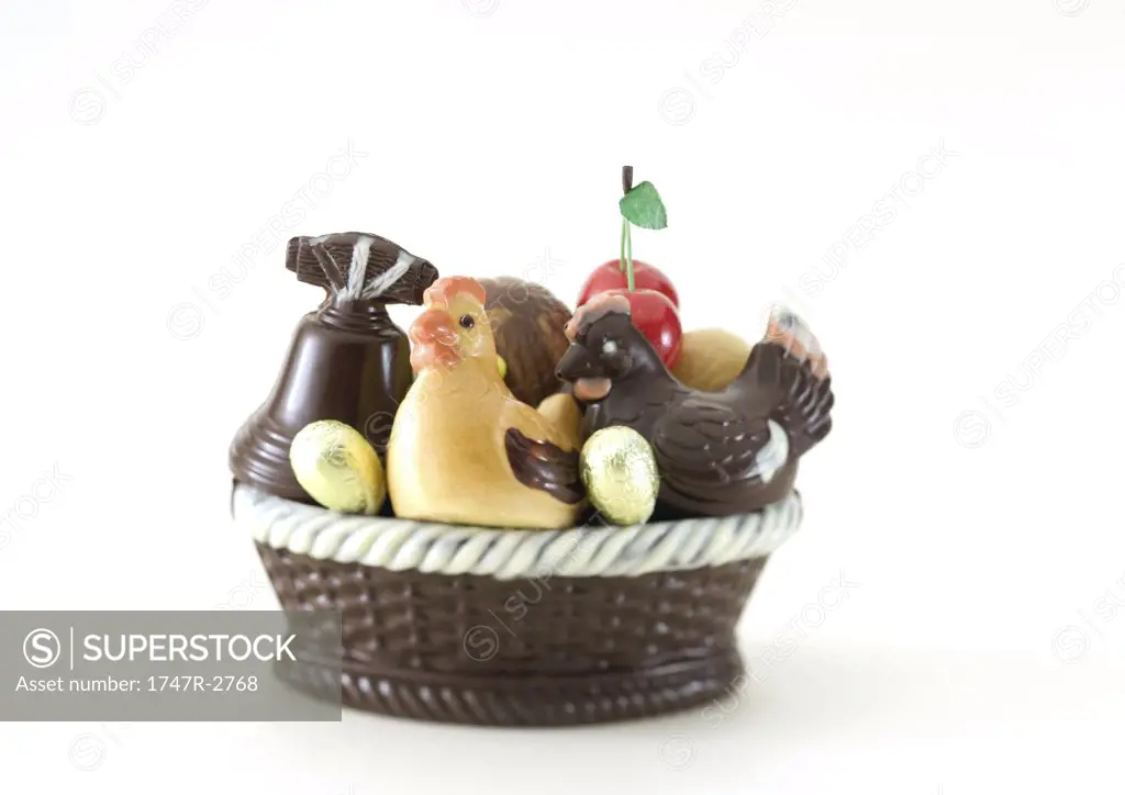 Basket of chocolate chickens, eggs and bell