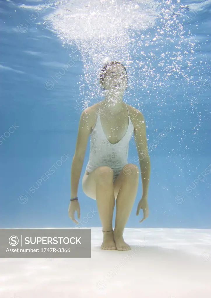 Teenage girl in pool, underwater view