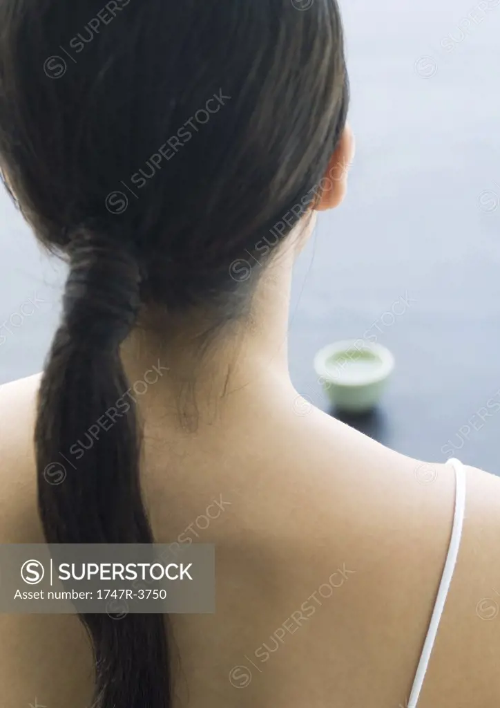 Woman, close-up of back of head and shoulders