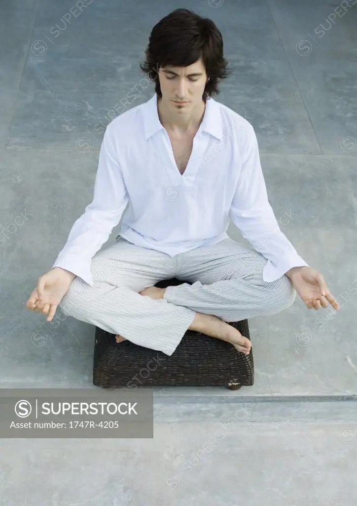 Man sitting in lotus position