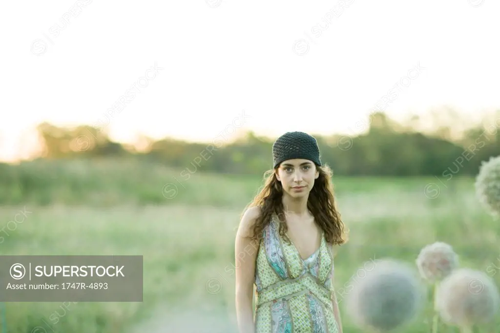 Young woman standing in field