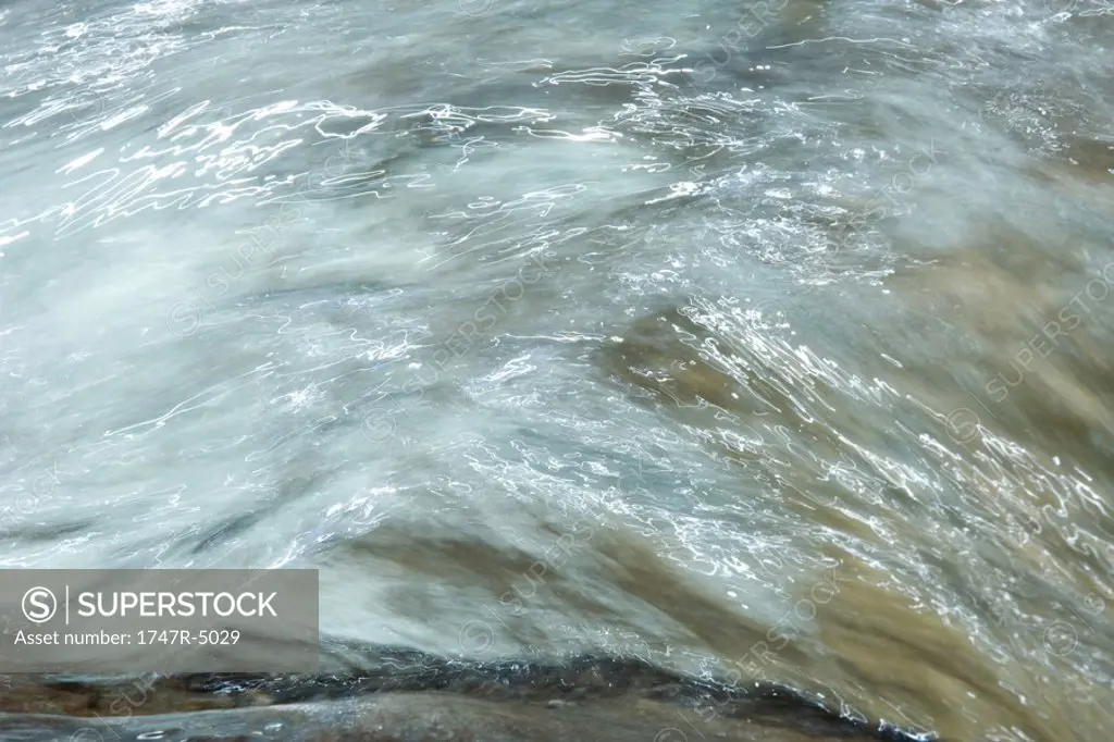 Water running, abstract view, full frame
