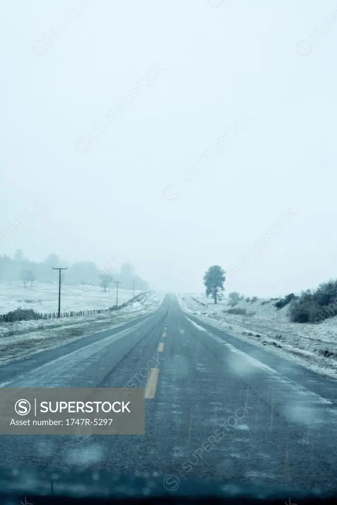 Road going through snowy landscape