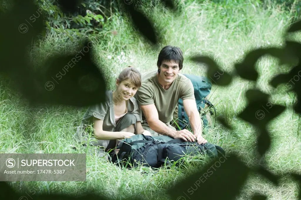 Couple of hikers in grass