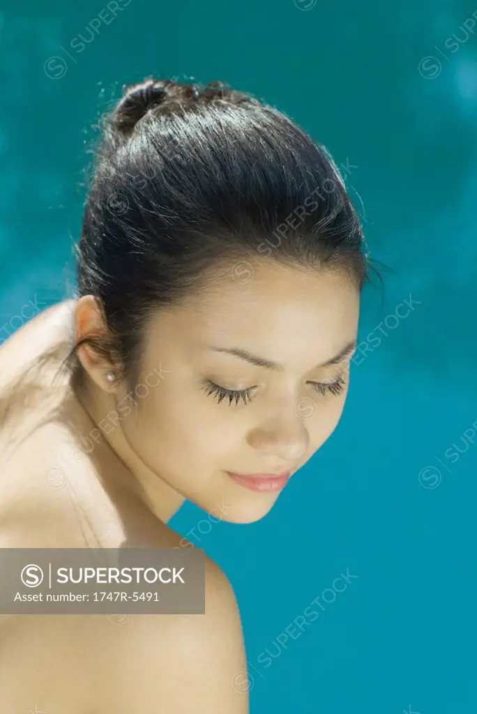 Young woman with bare shoulders, head and shoulders, portrait, high angle view