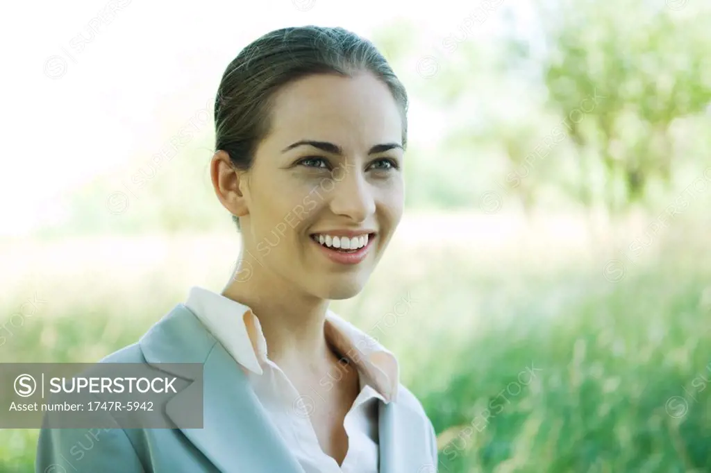 Businesswoman smiling, outdoors, portrait