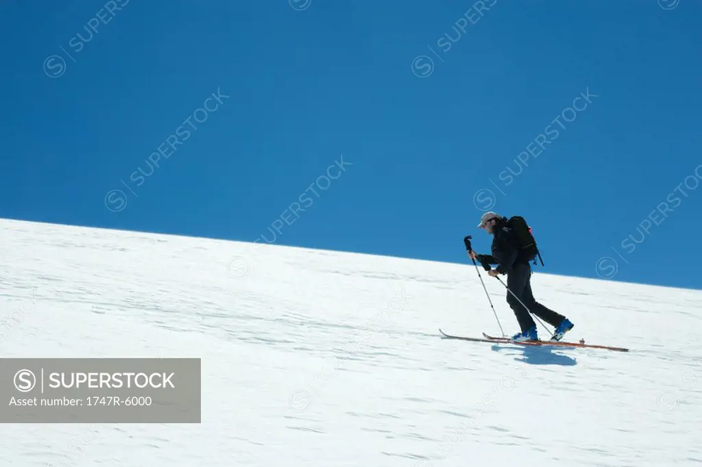 Skier moving uphill