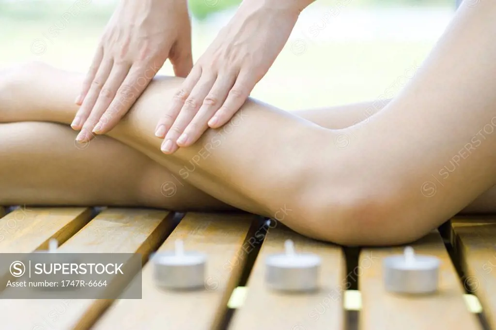 Woman receiving leg massage