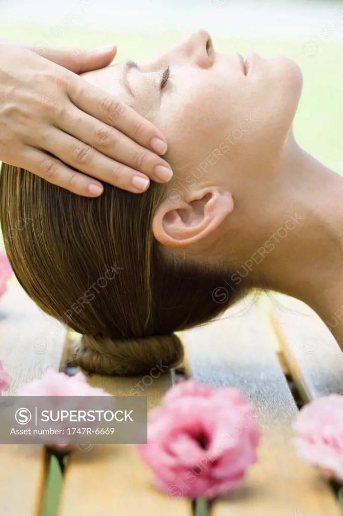 Woman having head massage