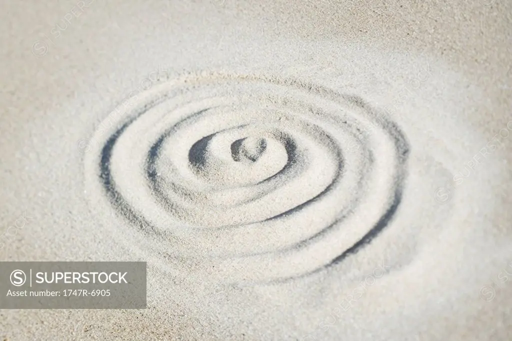 Spiral shape drawn in sand, view from directly above