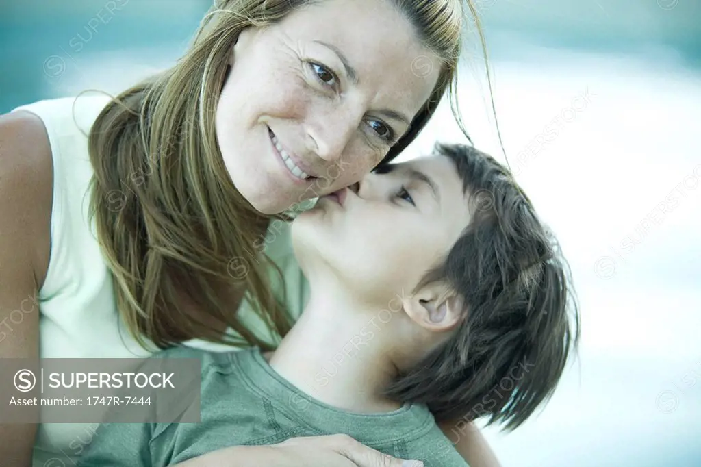 Boy and mother, boy kissing woman´s cheek