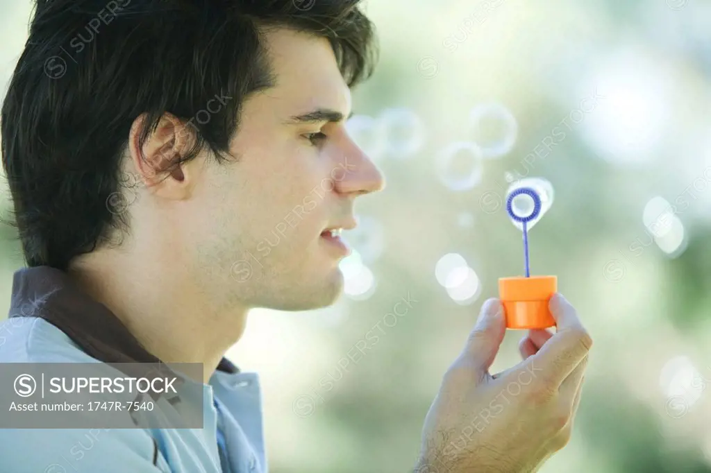 Man blowing bubbles