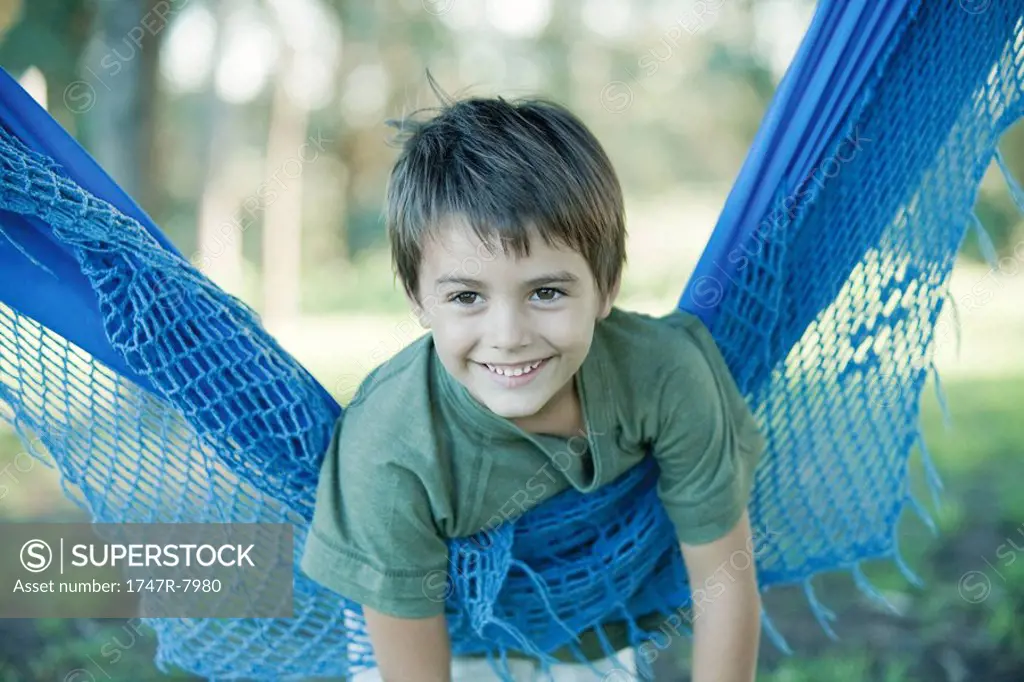Boy lying on hammock