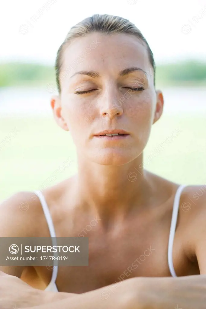 Woman with eyes shut, portrait