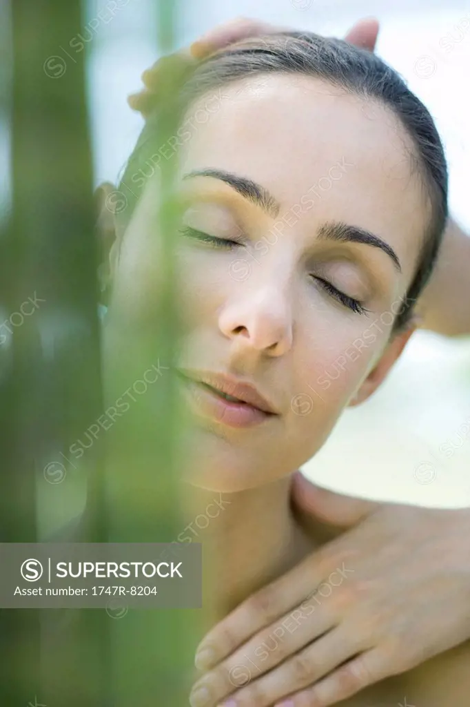 Woman receiving head and neck massage