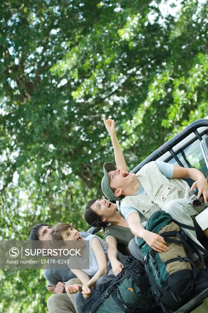 Young hikers in back of pick-up truck
