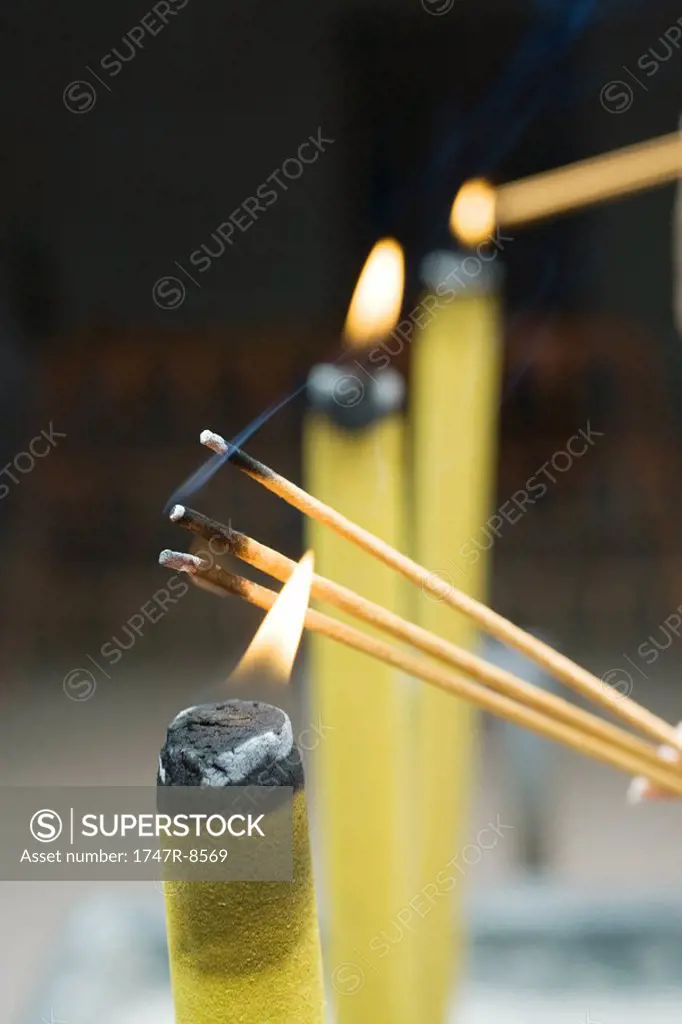 Lighting incense, close-up