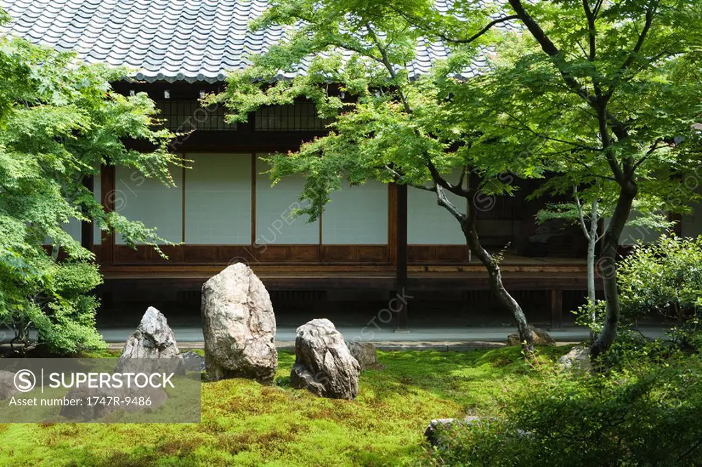 Japanese rock garden, traditional building in background