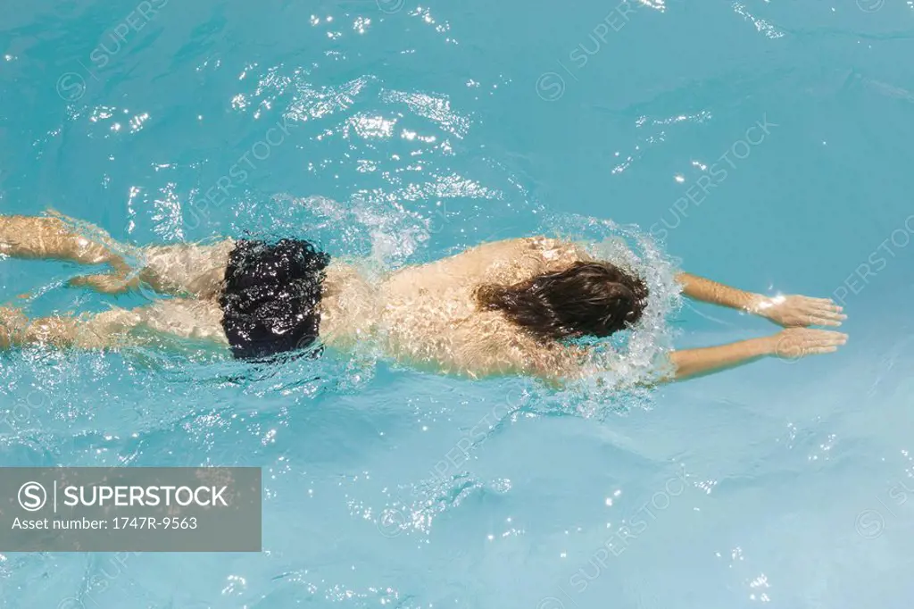 Man swimming in pool, high angle view