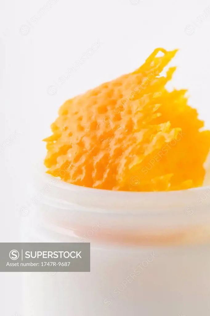 Orange rind in cosmetic jar, close-up