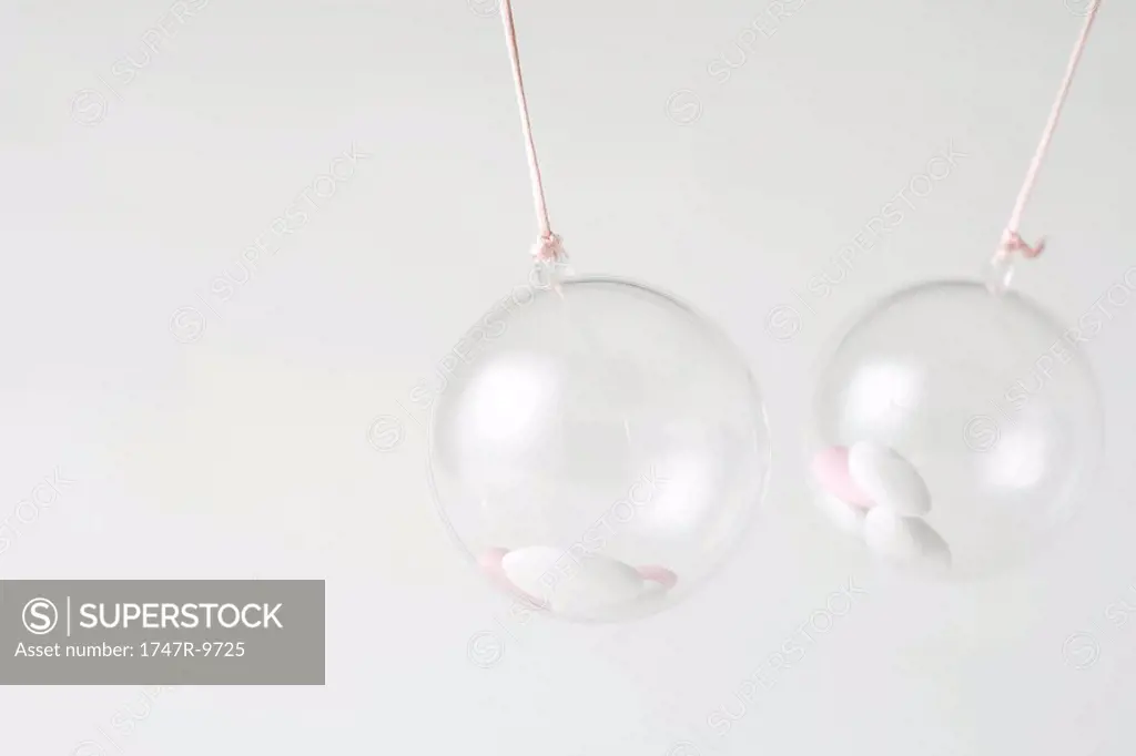 Glass ornaments containing candy, close-up