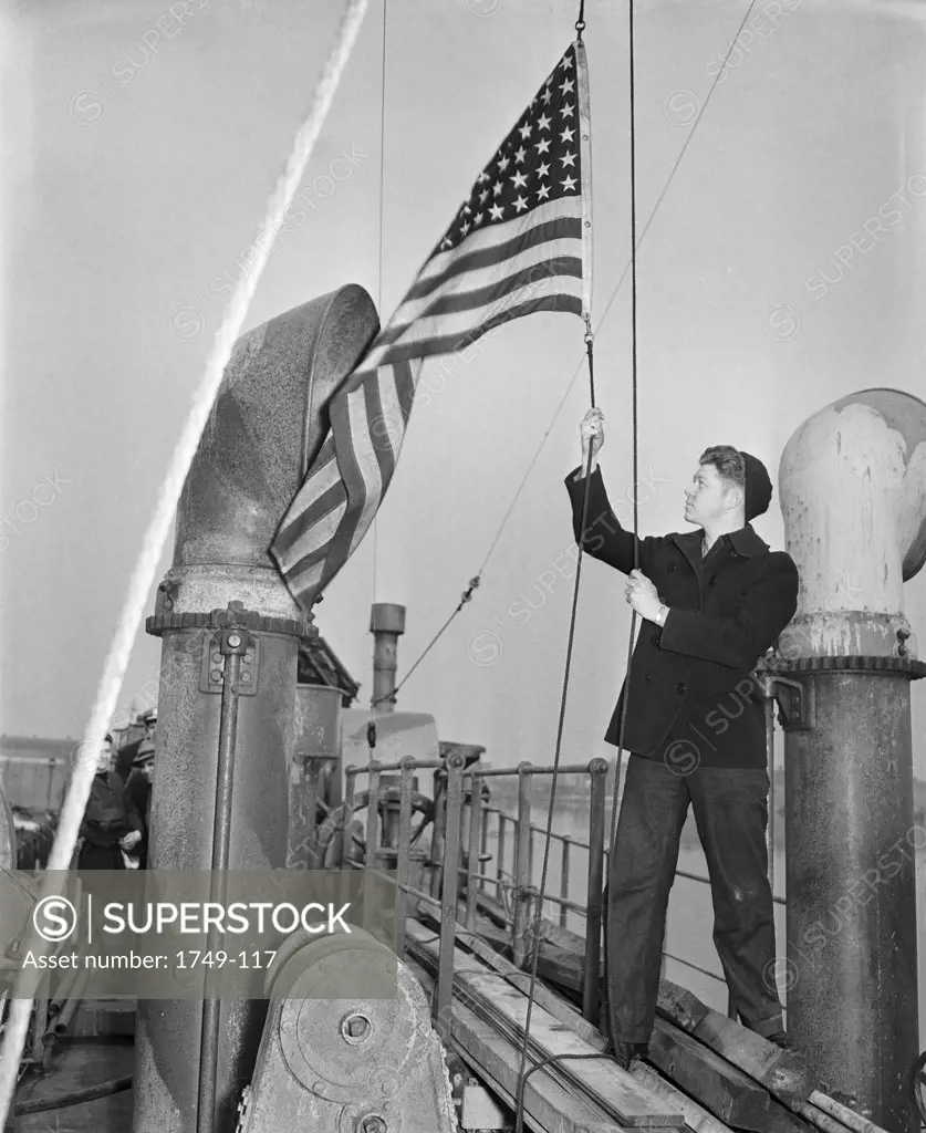 Sailor Raising Flag at Philadelphia Naval Yard, Pennsylvania, USA