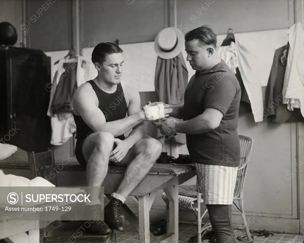 Light Heavyweight Boxing Champion Tommy Loughran with trainer Brady, Philadelphia Arena