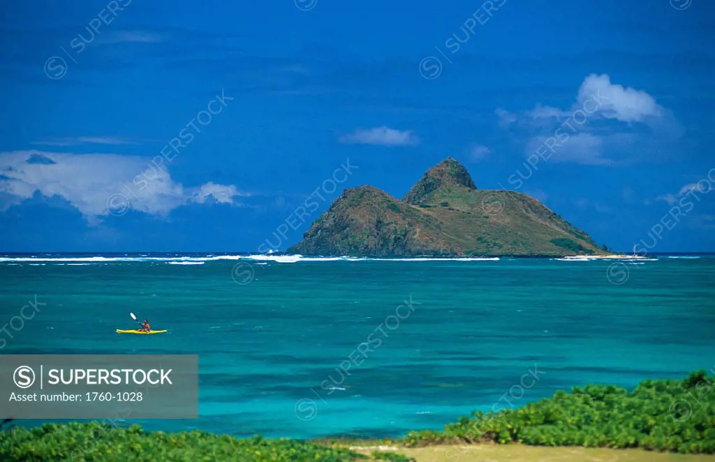 HI, distant view of kayaker along Windward coast Oahu, Mokulua in background A13A
