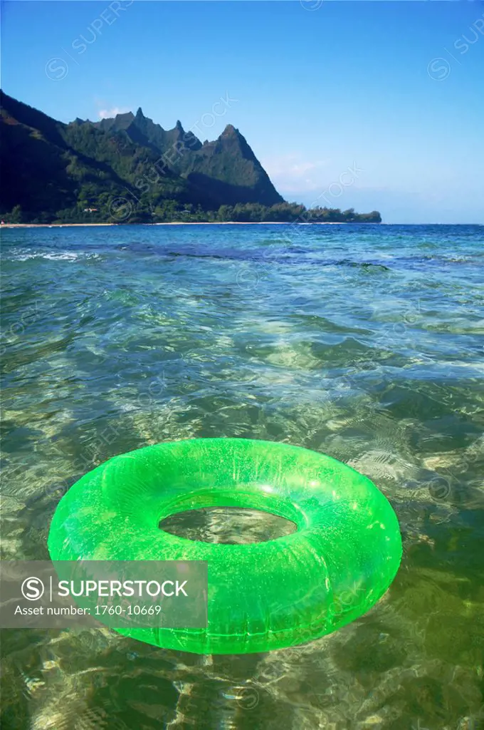 Hawaii, Kauai, Tunnels beach, Green innertube on the water.