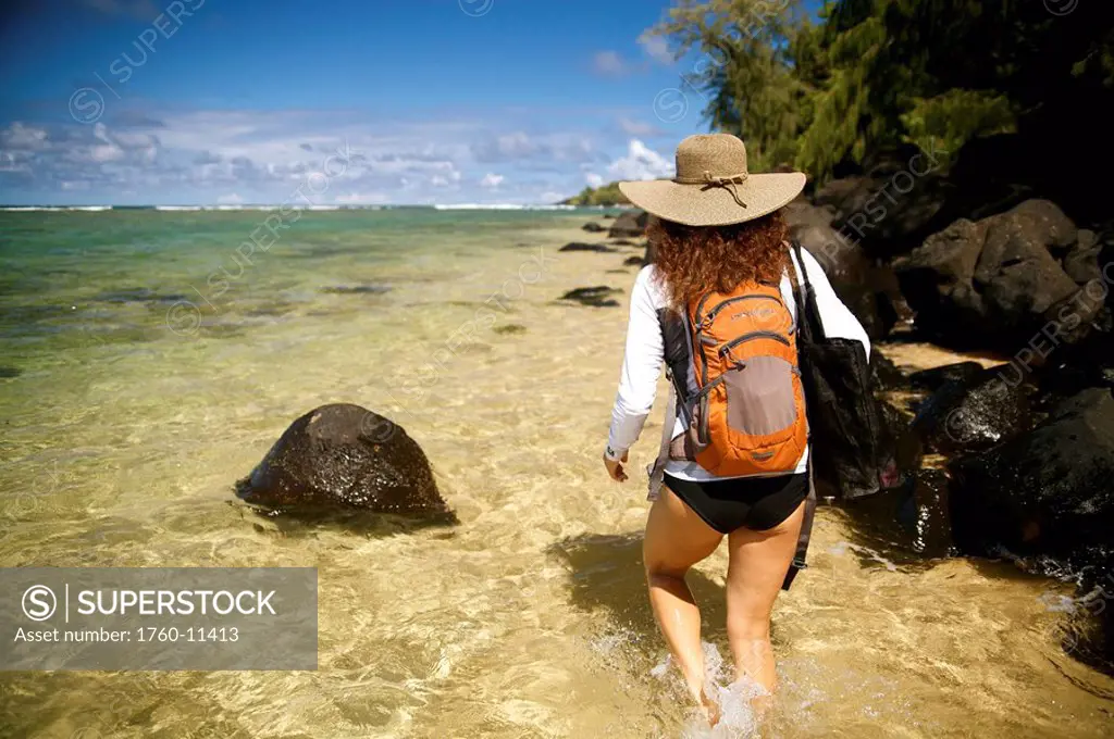 Hawaii, Kauai, Pila´a, Woman hiking through water.
