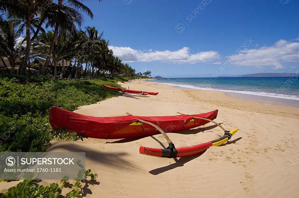 Hawaii, Maui, Kihei, Keawakapu Beach, Red outrigger canoe on sandy shore
