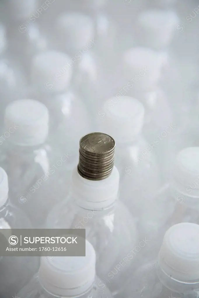 Hawaii, Oahu, Five Cents stacked on a plastic water bottle cap