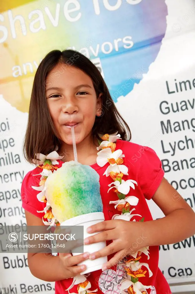 Hawaii, Oahu, Young girl drinking from a shave ice.