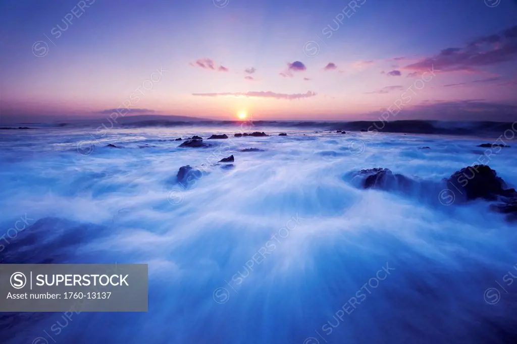 Hawaii, Maui, Makena, Dramatic vibrant sunset, ocean rushing over rocks