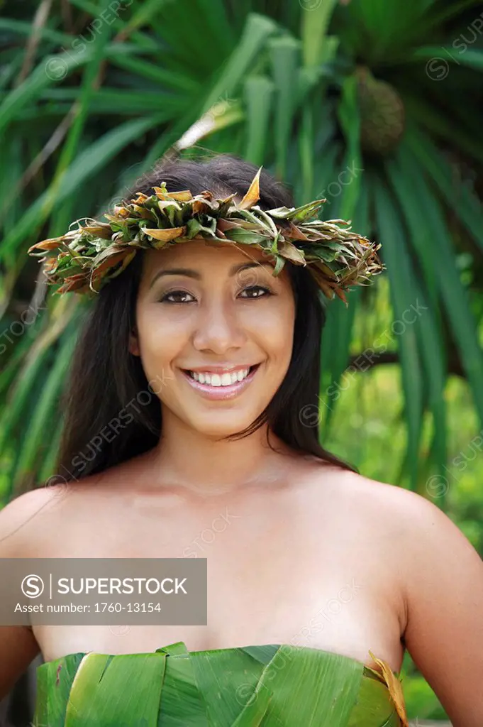 Hawaii, Oahu, Closeup of a Local Hawaiian Female wearing a haku smiling