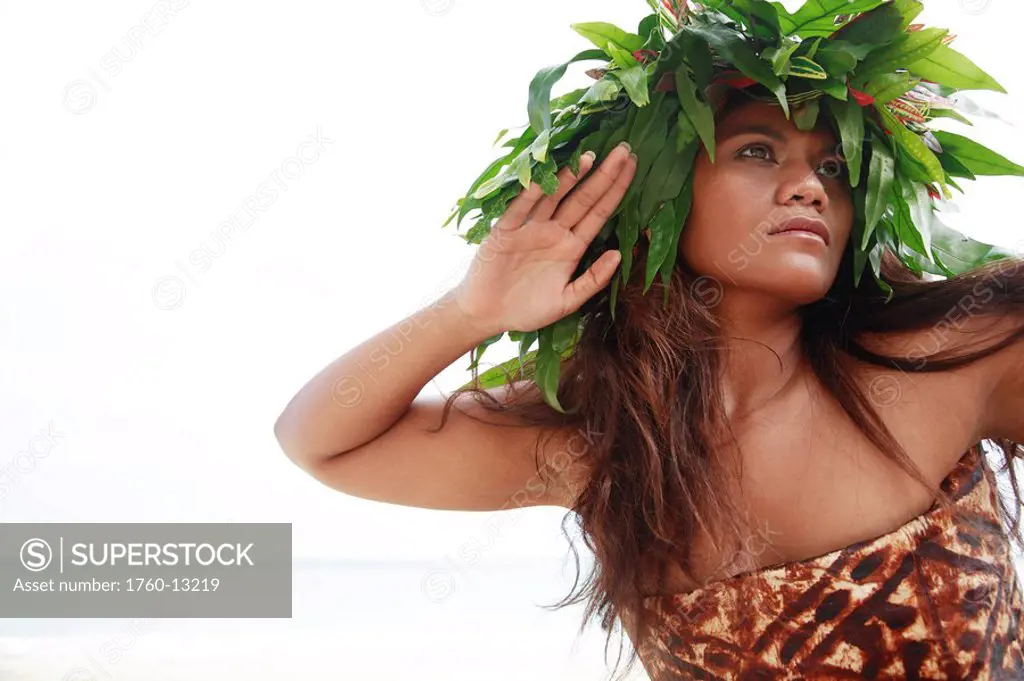 Hawaii, Oahu, Polynesian female posing wearing wild fern haku and tapa cloth