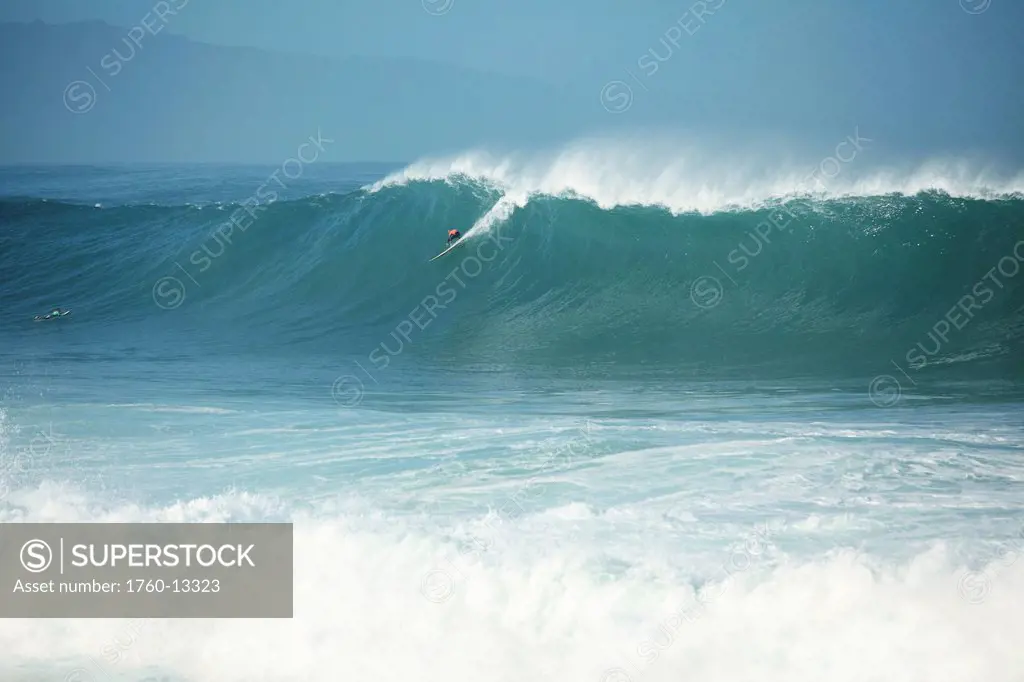 Hawaii, Oahu, North Shore, Waimea Bay, Surfer on a huge wave.