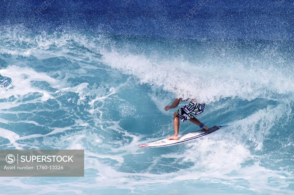 Hawaii, Oahu, North Shore, Surfer riding wave.