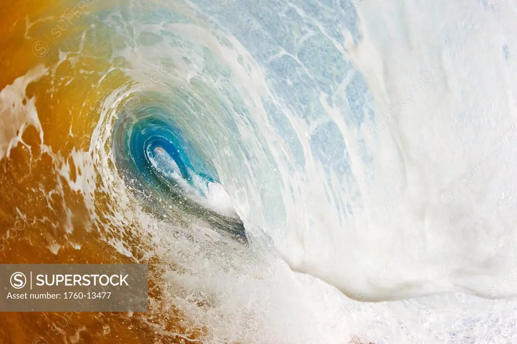 Hawaii, Maui, Makena Beach, View through tube of beautiful sandy wave.