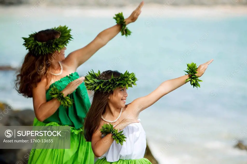 Hawaii, Maui, Mother and daughter dancing hula together.