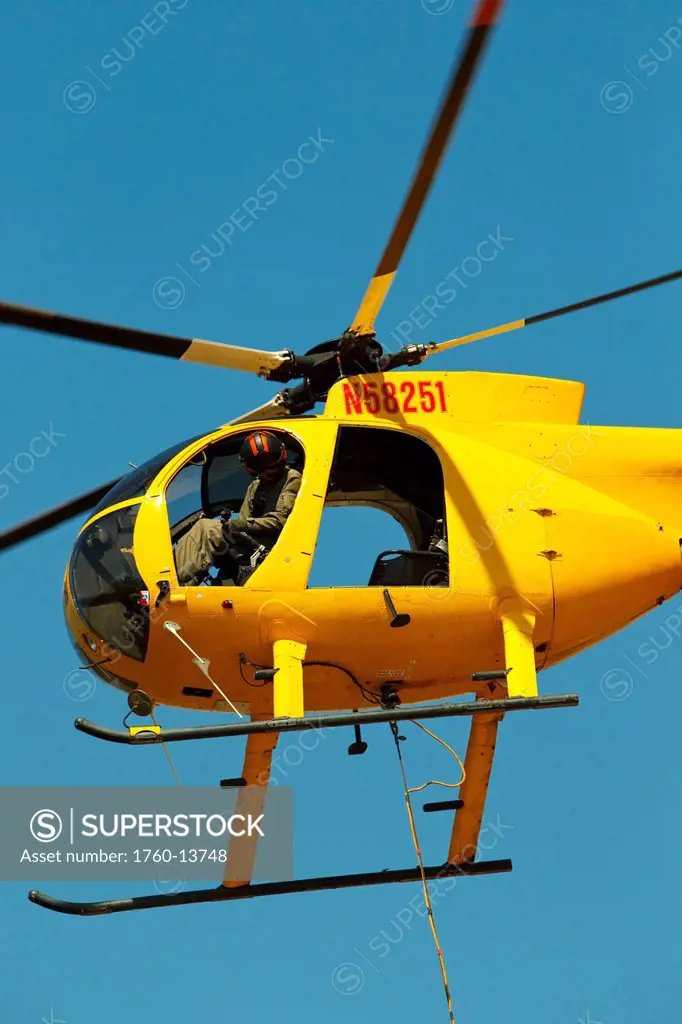 Hawaii, Maui, Ma´alaea, Fire helicopter working to put out wildfie. Editorial Use Only.