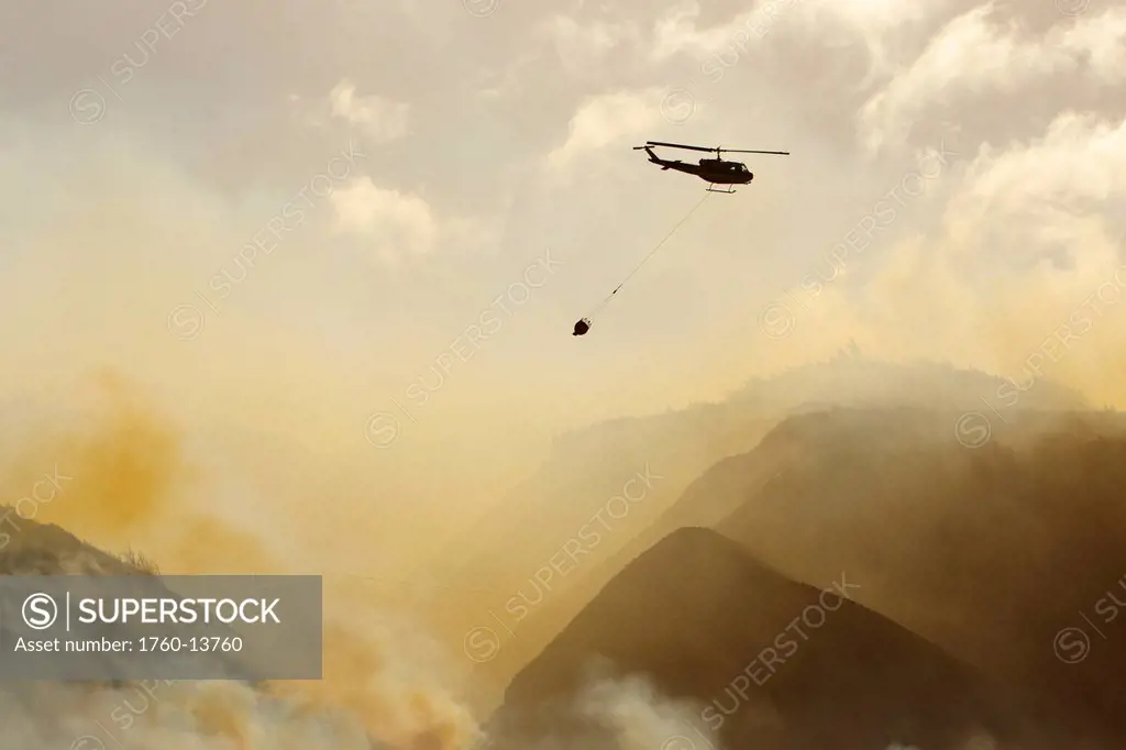 Hawaii, Maui, Ma´alaea, Fire helicopter dropping ocean water on wildfire. Editorial Use Only.