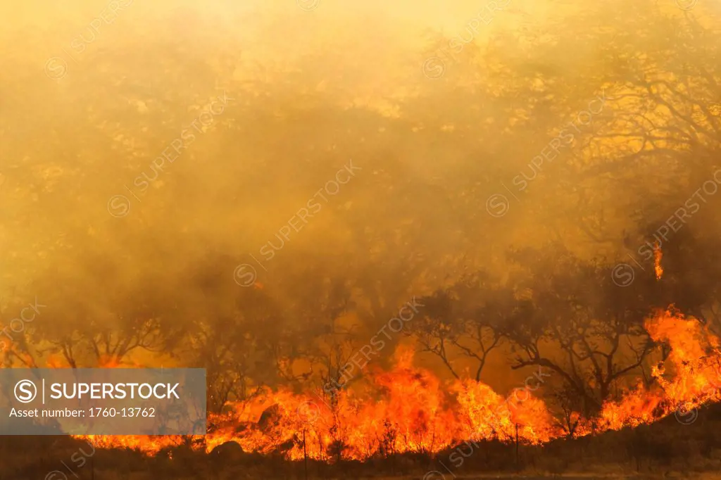 Hawaii, Maui, Ma´alaea, Wildfire burning brush on West Maui Mountains, Smoky haze.