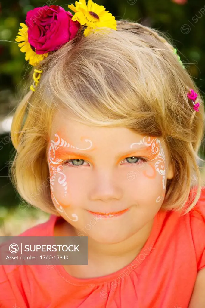 Hawaii, Young girl wearing facepaint.
