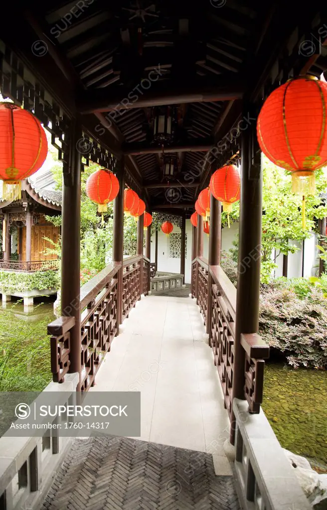 Oregon, Portland, Chinatown, Chinese Gardens, Pathway and bridge with Chinese lanterns.