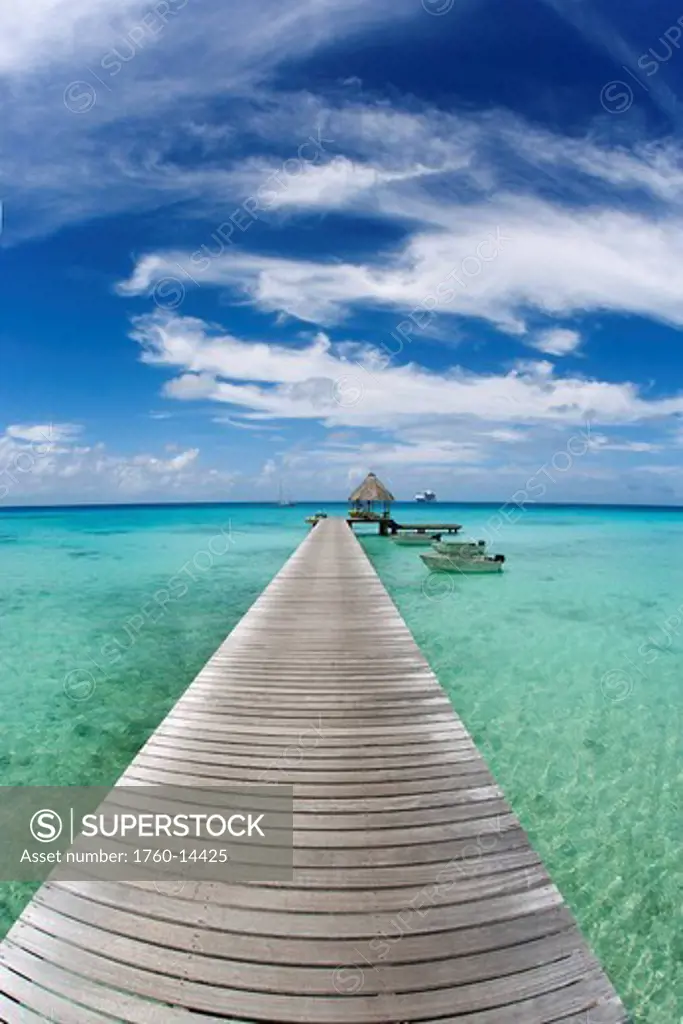 French Polynesia, Tuamotu Islands, Rangiroa Atoll, Resort pier and boats.