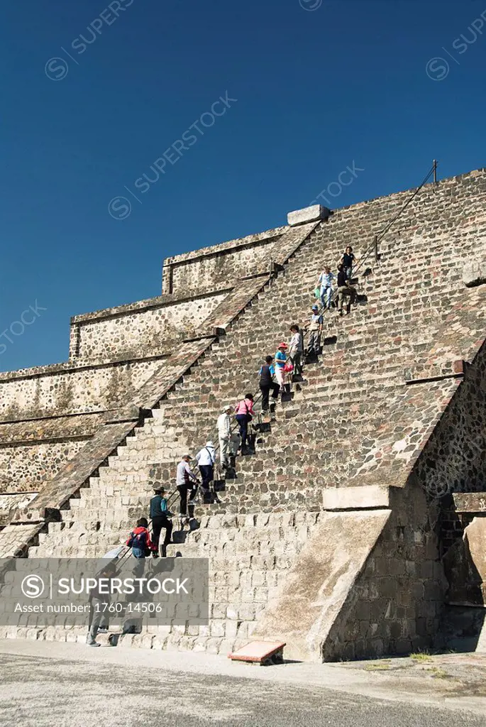 Mexico, State of Mexico, Archaeological Zone of Teotihuacan, Tourists climbing stairs of the Pyramid of the Moon.