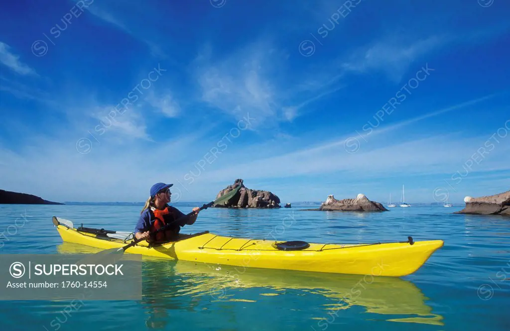 Mexico, Baja California Sur, Sea of Cortez at Espiritu Santo Island near La Paz, Woman sea kayaking.