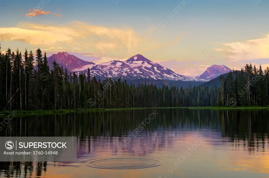 Oregon, Cascade Mountains, Scott Lake and Three Sisters mountain peaks, Sunset light.